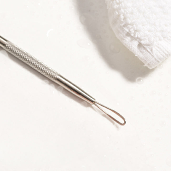 Metal tool with textured handle on a white background